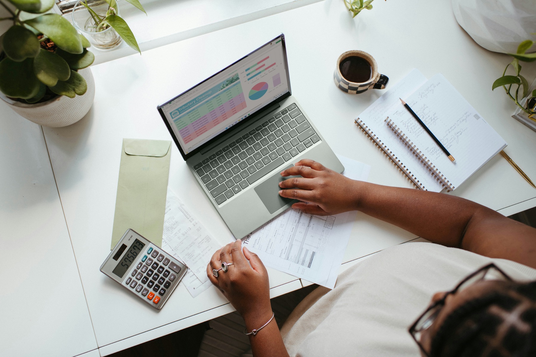 Person reviewing their finances calmly on a laptop